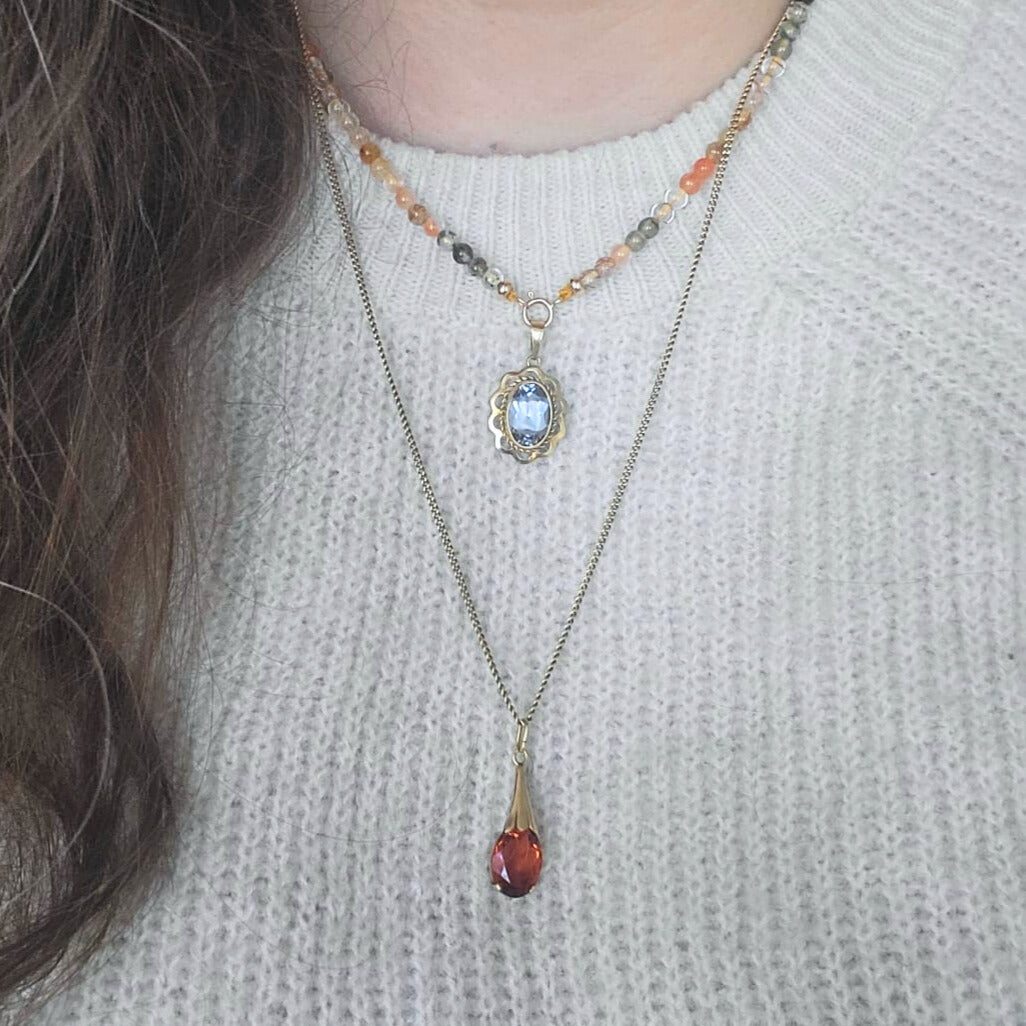 Vintage 14k gold pendant with orange stone