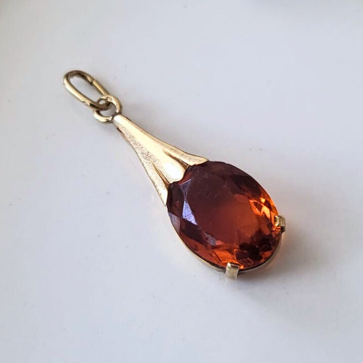 Vintage 14k gold pendant with orange stone