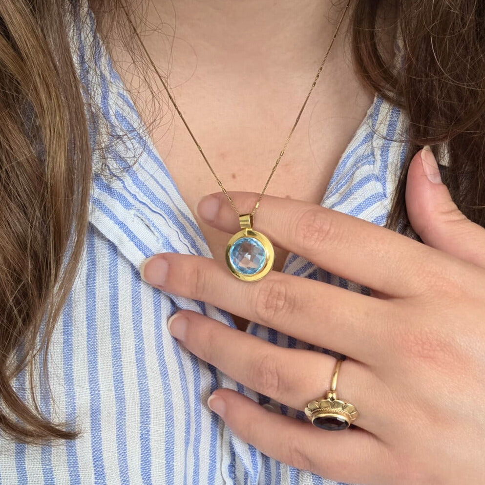 Vintage 14k gold pendant with topaz round