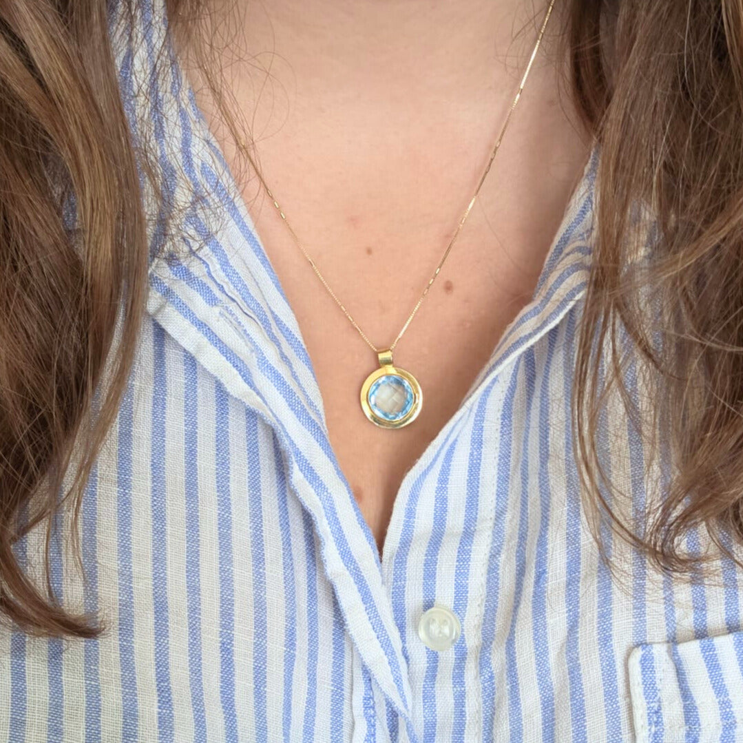 Vintage 14k gold pendant with topaz round
