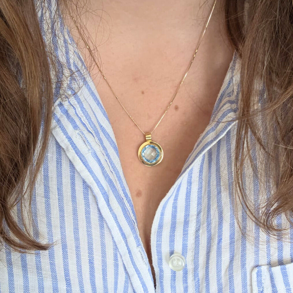 Vintage 14k gold pendant with topaz round