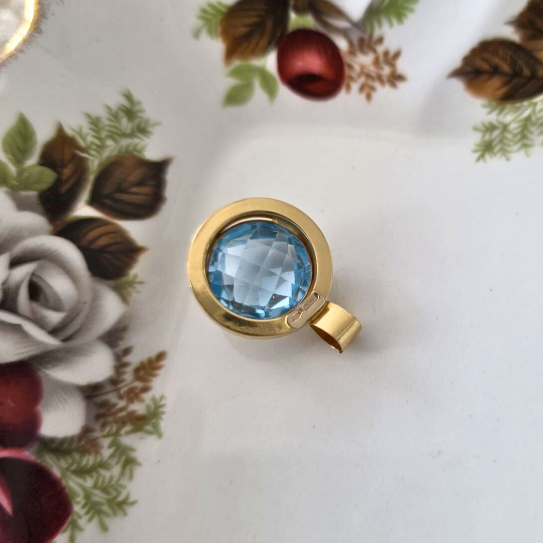 Vintage 14k gold pendant with topaz round