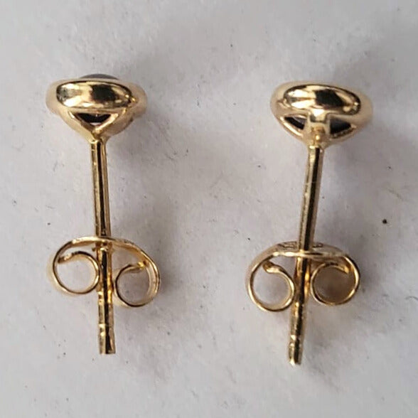 Pre-owned 14k gold earrings with purple stones