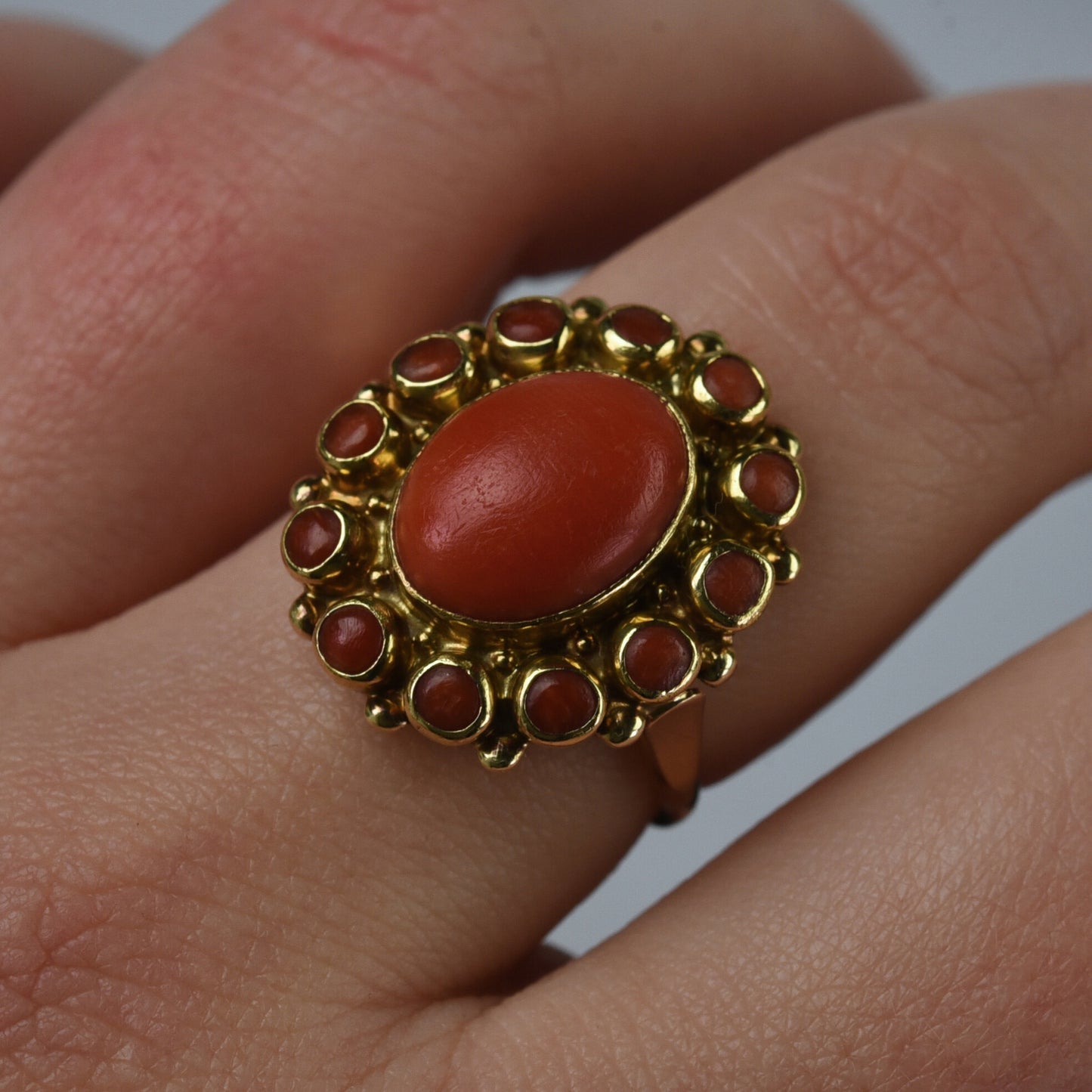 Vintage 14k gold ring with large red coral entourage