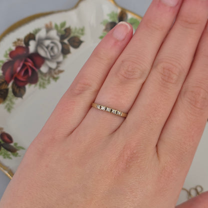 Vintage 14k gold ring with a row of diamonds