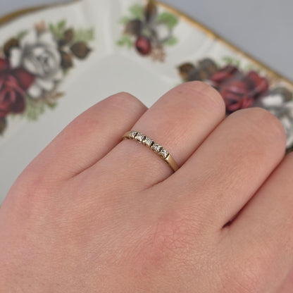 Vintage 14k gold ring with a row of diamonds