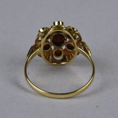 Vintage 14k gouden ring met granaat entourage