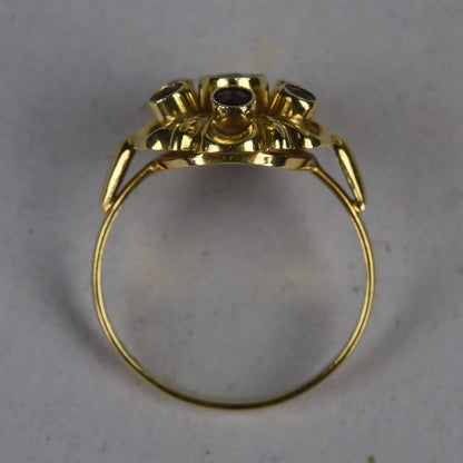Vintage 14k gouden ring met granaat entourage