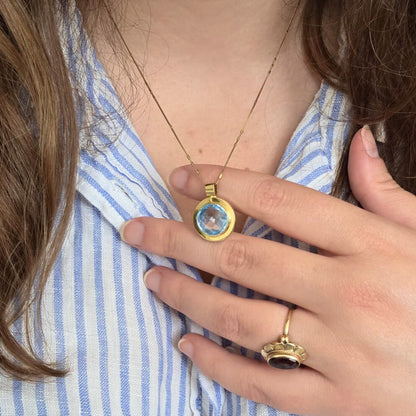 Vintage 14k gold pendant with topaz round