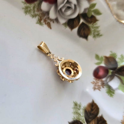 Vintage 14k gouden hanger met granaat entourage