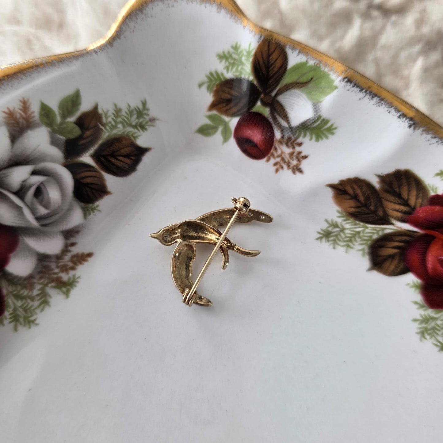 Vintage 14k gouden broche met diamant zwaluw