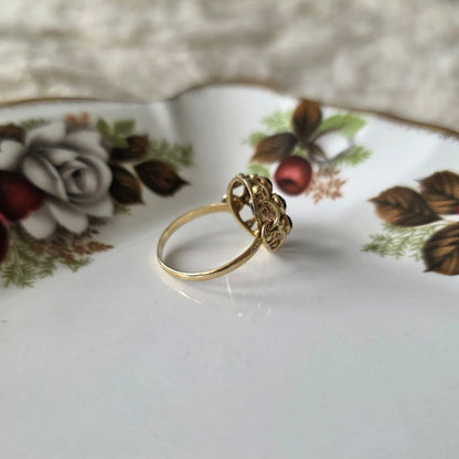 Vintage 14k gouden ring met granaat entourage