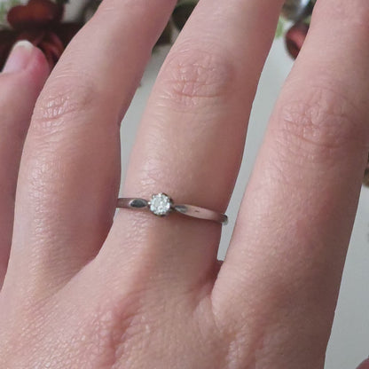 Vintage 18k white gold engagement ring with engravings and a 0.1ct solitaire diamond.