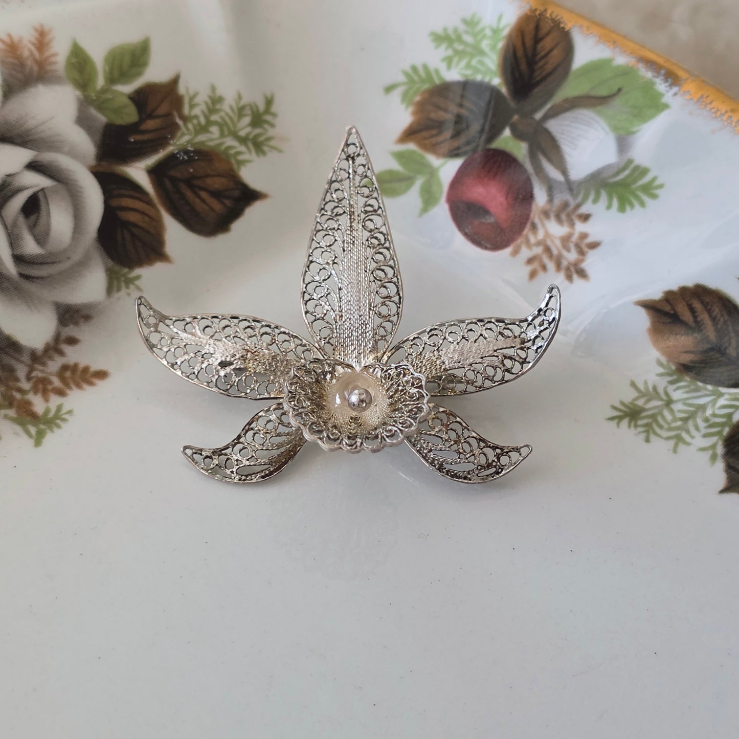 Antique silver filigree orchid brooch