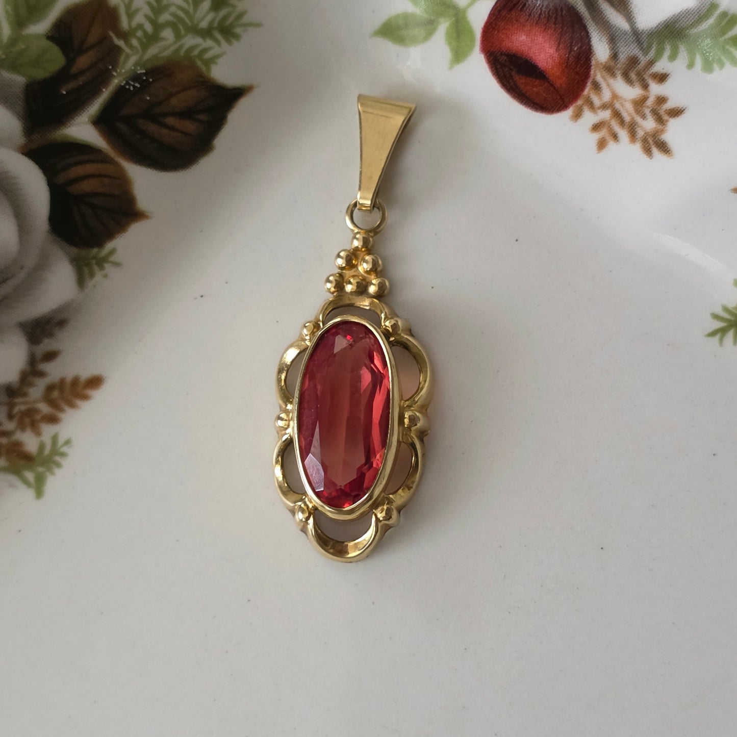 Vintage 14k gouden hanger met oranje saffier