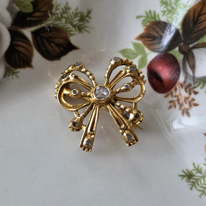 Antieke 14k gouden strik broche met roosdiamanten
