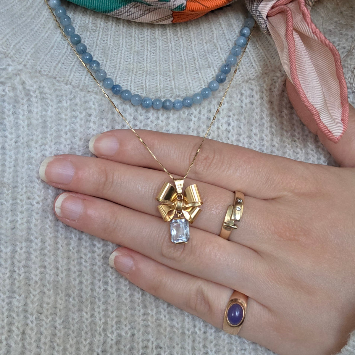 Vintage 18k gouden hanger strik met aquamarijn