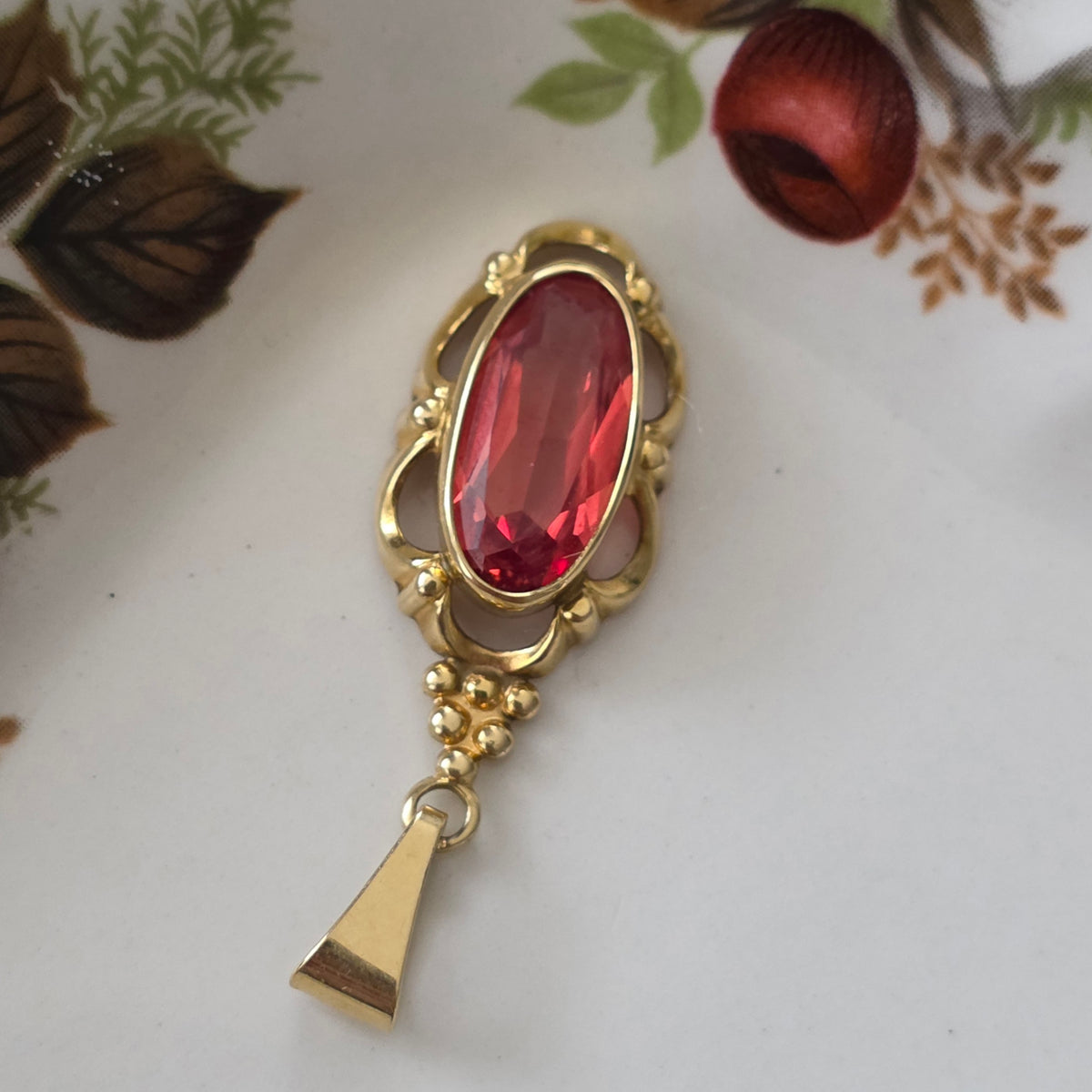 Vintage 14k gouden hanger met oranje saffier