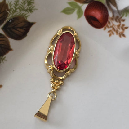 Vintage 14k gouden hanger met oranje saffier
