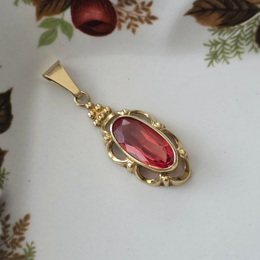 Vintage 14k gouden hanger met oranje saffier