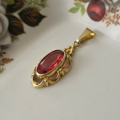Vintage 14k gouden hanger met oranje saffier