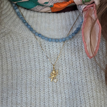 Vintage 18k gold Cupid pendant