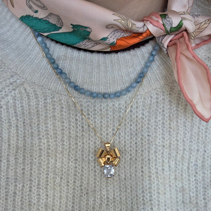 Vintage 18k gouden hanger strik met aquamarijn