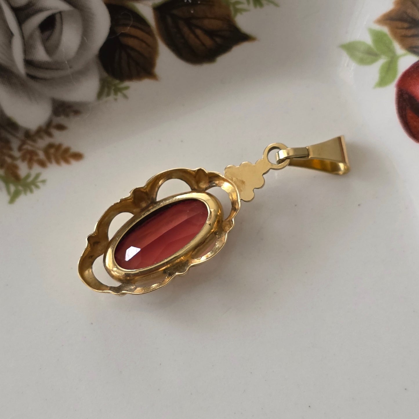 Vintage 14k gouden hanger met oranje saffier