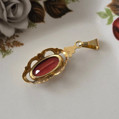 Vintage 14k gouden hanger met oranje saffier