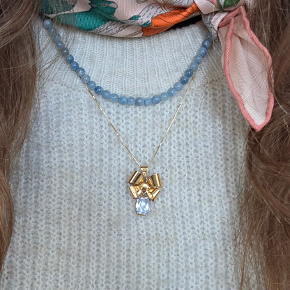 Vintage 18k gouden hanger strik met aquamarijn